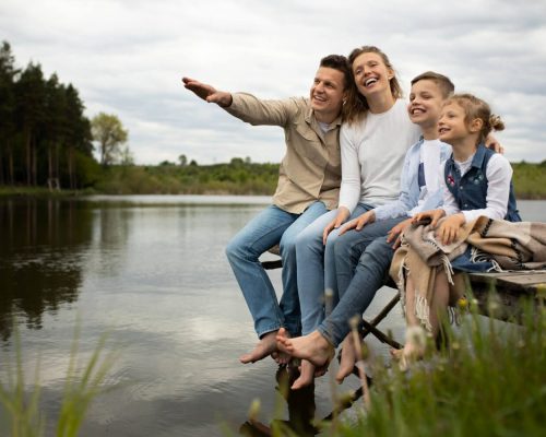 full-shot-happy-family-outdoors